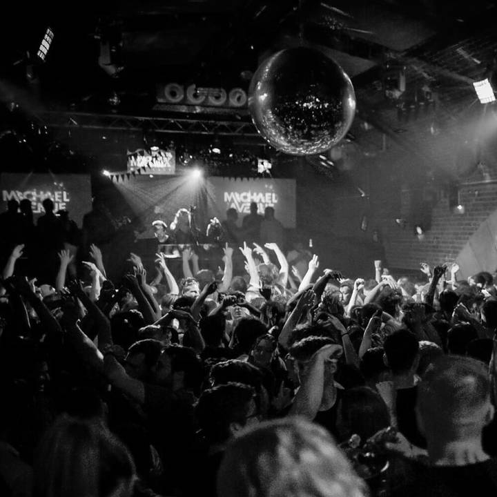 Michael Avenue playing to a packed club, crowd with their hands in the air