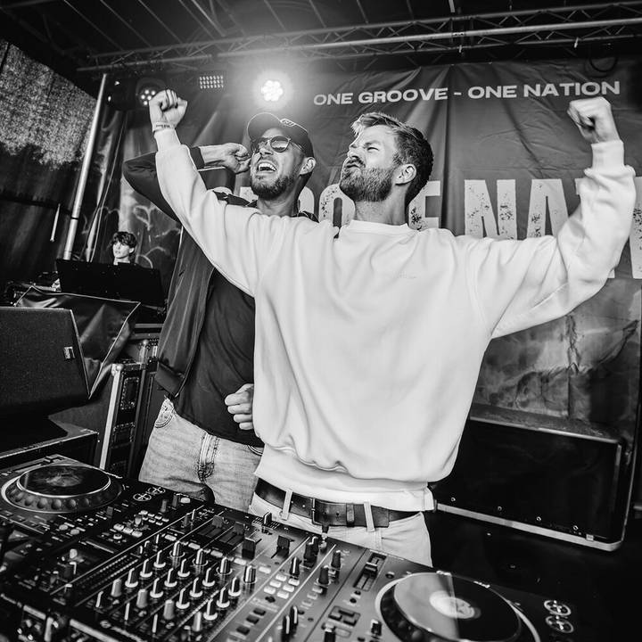 Topmodelz behind the decks on a festival stage